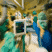 Medical Team in Surgical Environment Medical professionals in surgical attire working in an operating room setting.