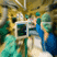Medical Team in Surgical Environment Medical professionals in surgical attire working in an operating room setting.